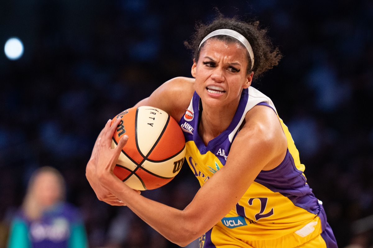 Los Angeles Sparks guard Rae Burrell (12) drives hard to the basket during a match between New York Liberty and Los Angeles Sparks on Tuesday, July 28, 2026 at Crypto.com Arena