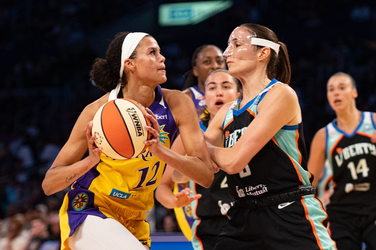 Los Angeles Sparks guard Rae Burrell (12) drives hard to the basket during a match between New York Liberty and Los Angeles Sparks on Tuesday, July 28, 2026 at Crypto.com Arena