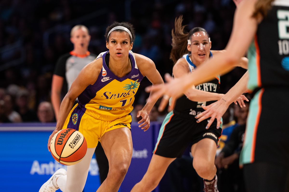 Los Angeles Sparks guard Rae Burrell (12) dribbles the ball and looks for a teammate during a match between New York Liberty and Los Angeles Sparks on Tuesday, July 28, 2026 at Crypto.com Arena