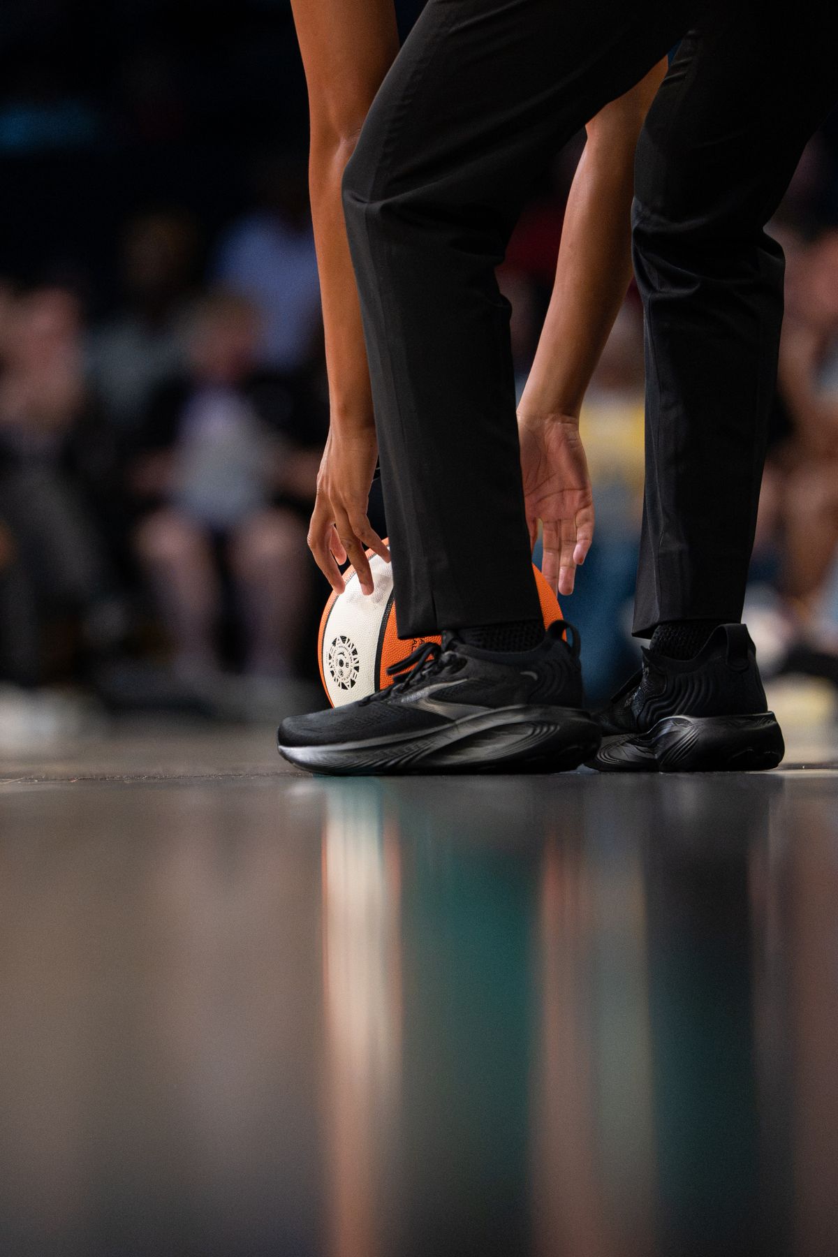 NBA referee picking up a basketball during a WNBA basketball game between the Golden State Valkyries and LA Sparks on August 9th, 2026 in Los Angeles, CA. NBA referee picking up a basketball during a WNBA basketball game between the Golden State Valkyries and LA Sparks on August 9th, 2026 in Los Angeles, CA.