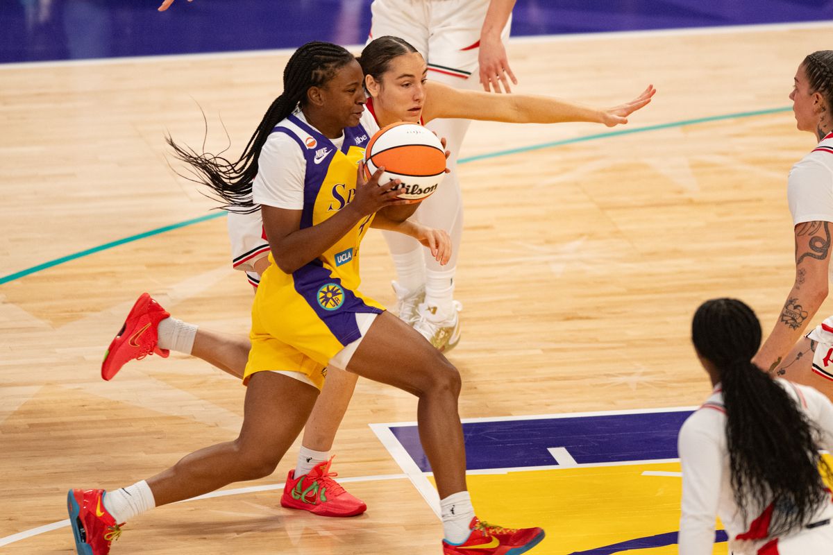 Los Angeles Sparks guard Tonie Morgan (4) drives down the middle during an NBA match between Portland Fire and Los Angeles Sparks on Sunday, September 20, 2026 at Crypto.com Arena in Los Angeles, California.